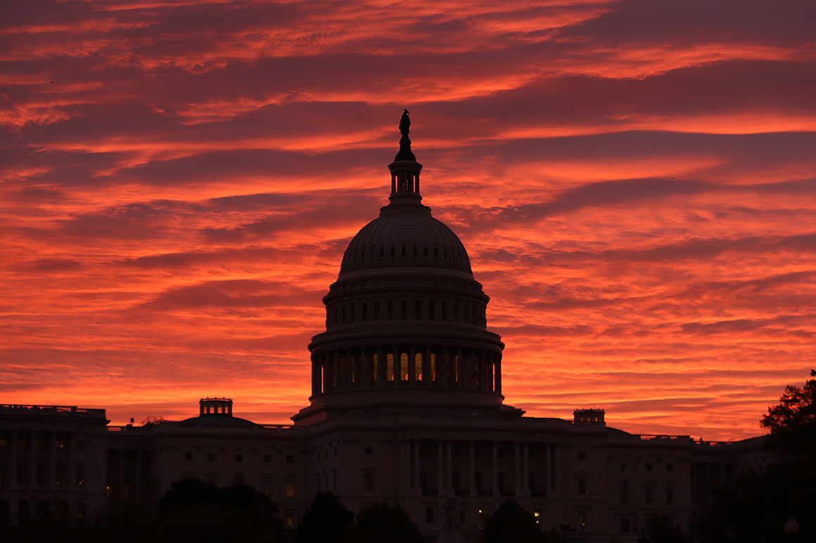 sunset behind US capitol building