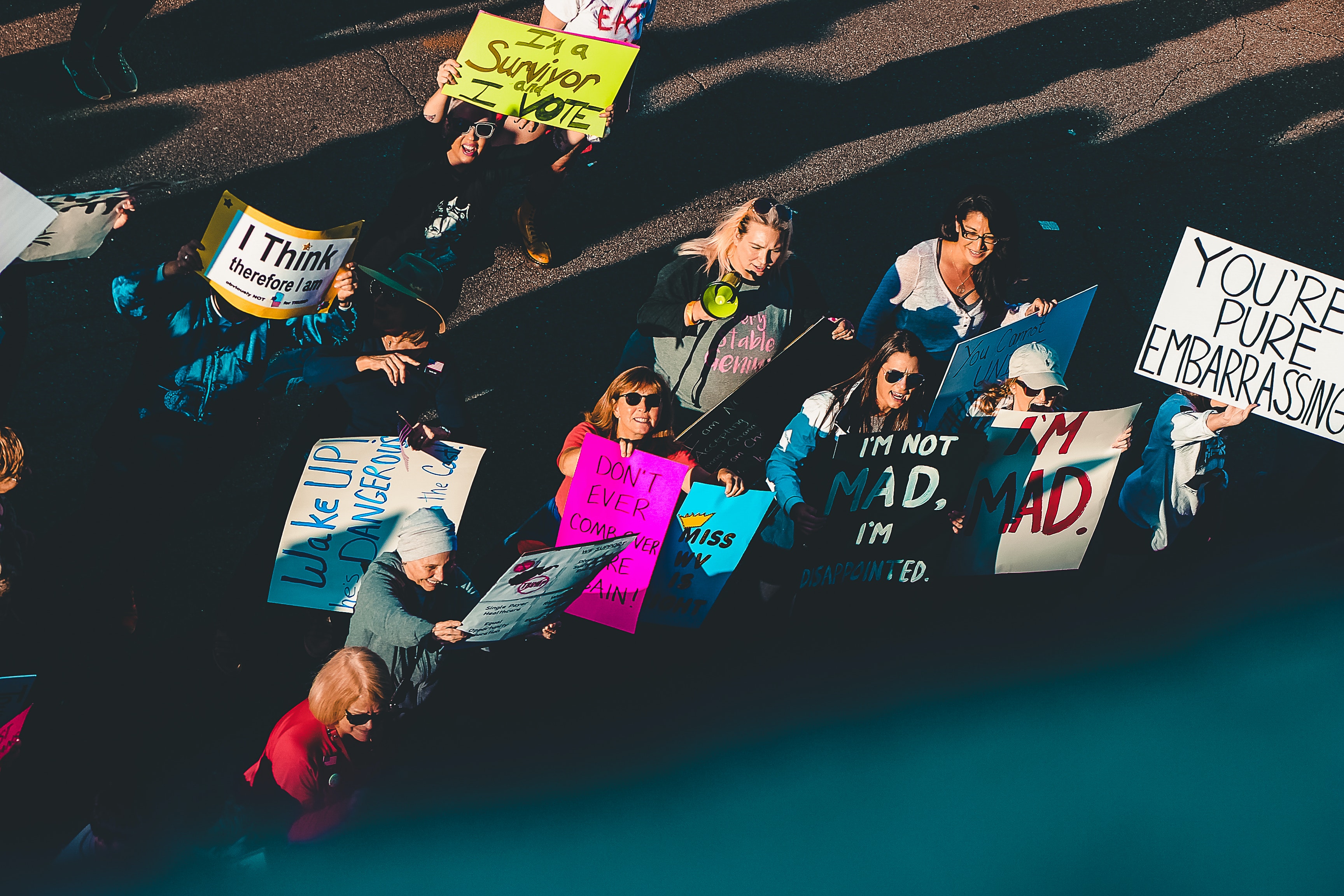 A crowd protesting with signs